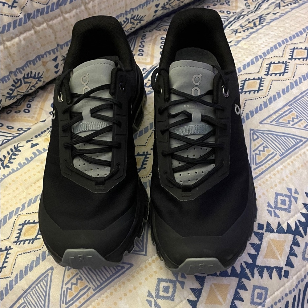 On Running Women’s Black and Olive Green Athletic Shoes
